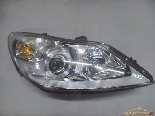 Крышка корпуса передней фары HID (10 контактов) правая Genesis BH 921043M030 07-11