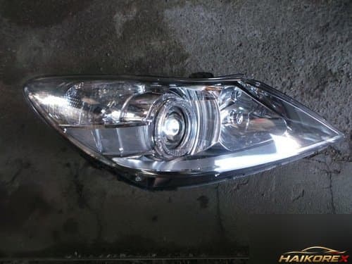 Крышка фары передней HID 10pin правая 921043M030