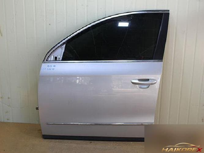 Volkswagen Passat 2009 — передняя дверь левая